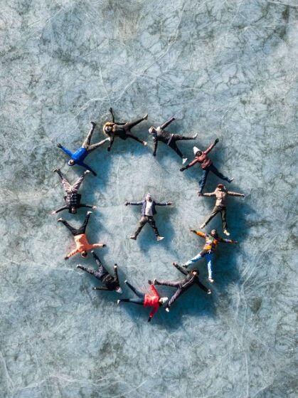 People creating an artistic circle representing collectivist cultures and communities